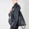 Black Patchwork Drawstring Backpack and jacket on Model